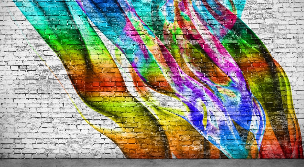 abstract colorful graffiti on brick wall